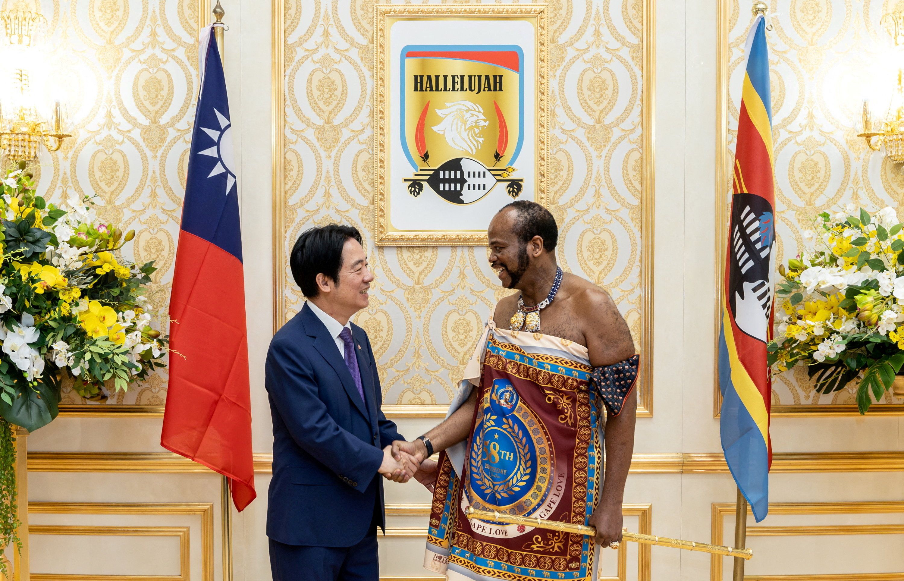 Taiwanese President Lai Ching-te shakes hands with King Mswati III, the King of Eswatini