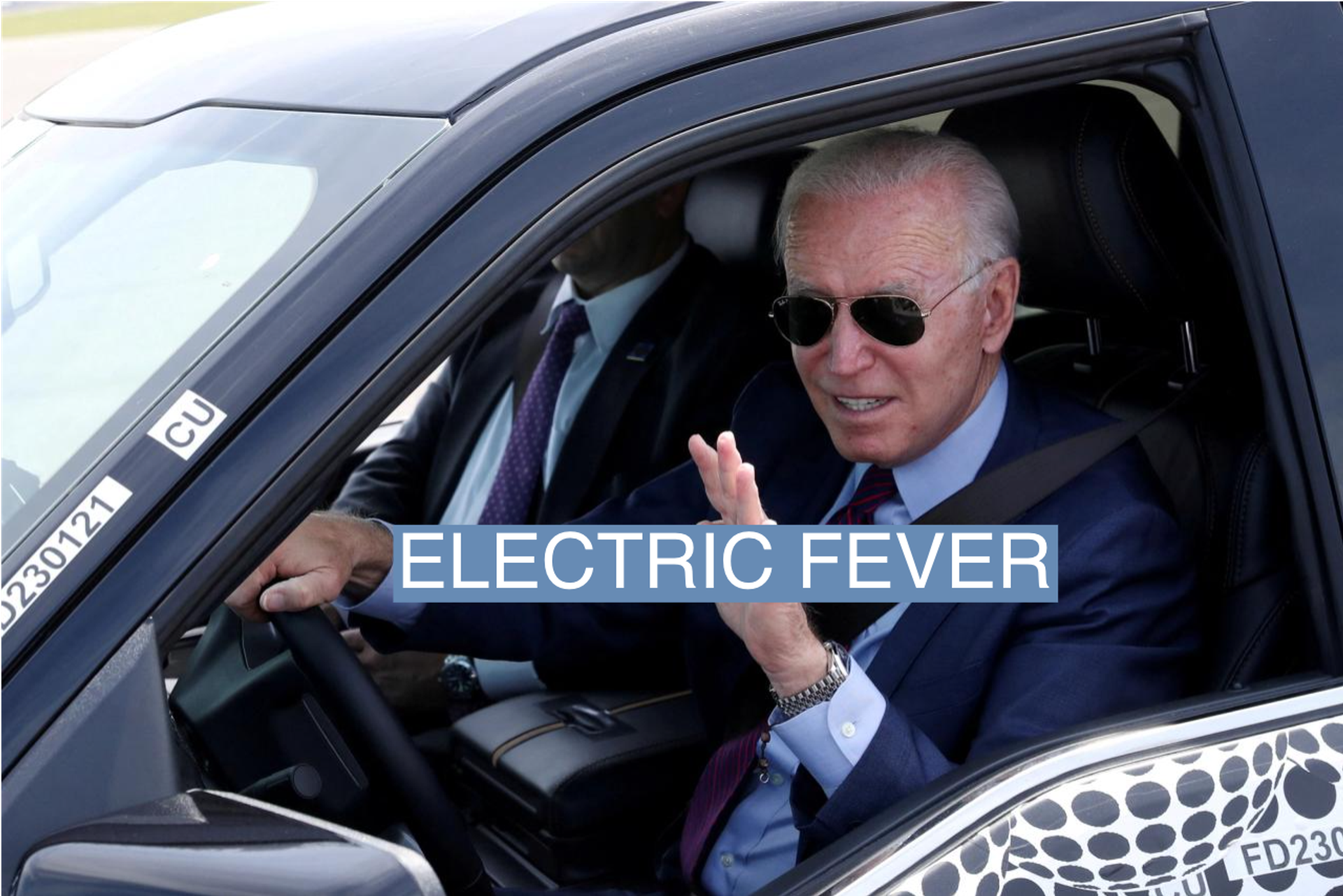  U.S. President Joe Biden waves as he tests the new Ford F-150 lightning truck as he visits VDAB at Ford Dearborn Development Center in Dearborn, Michigan, on May 18, 2021