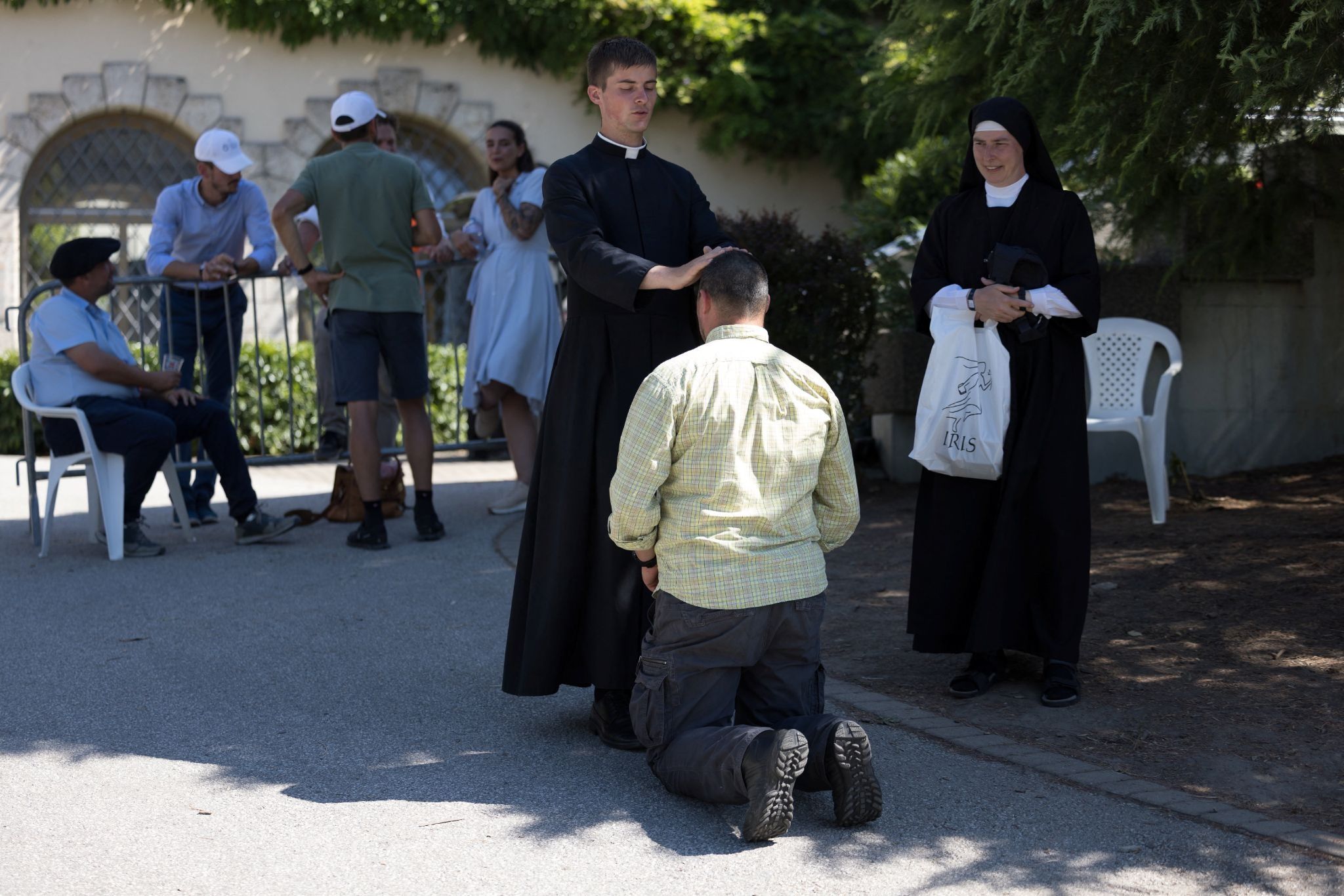 A faithful receives a blessing in front of the traditionalist Catholic Society of Saint Pius X (SSPX) in Econe, Switzerland