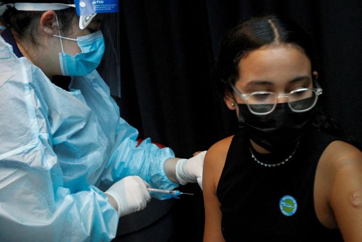 A girl is inoculated against the coronavirus disease.