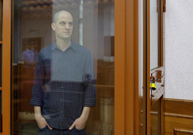 Wall Street Journal reporter Evan Gershkovich, who stands trial on spying charges, is seen inside an enclosure for defendants before a court hearing in Yekaterinburg, Russia June 26, 2024. REUTERS/Evgenia Novozhenina
