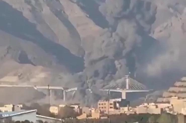 Screenshot of a Trump-posted video showing the destruction of a bridge in Iran