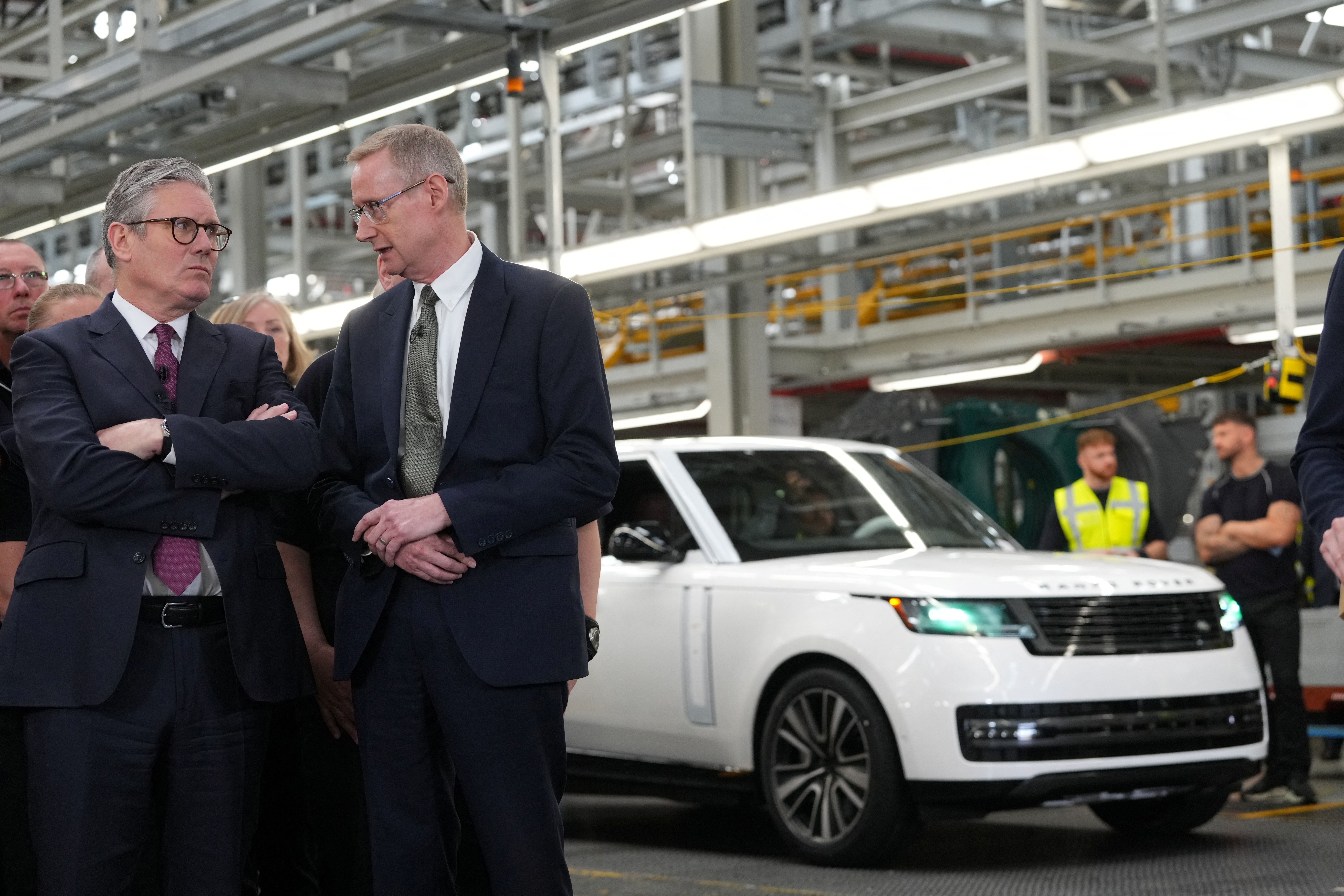 The CEO of Jaguar Land Rover Adrian Mardell speaks with UK Prime Minister Keir Starmer at a factory in Birmingham, UK. 