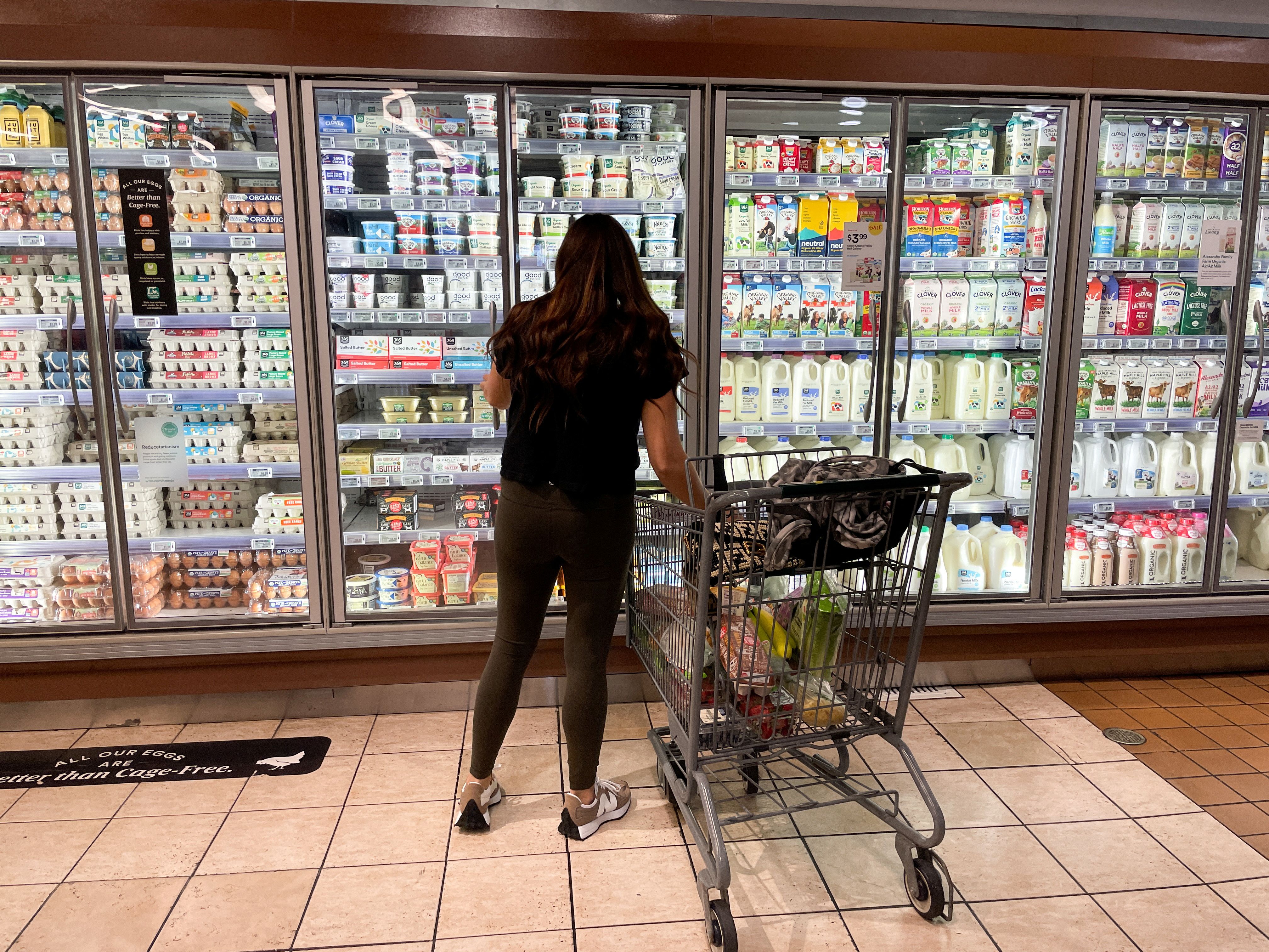 A woman shops in a supermarket as rising inflation affects consumer prices in Los Angeles, California