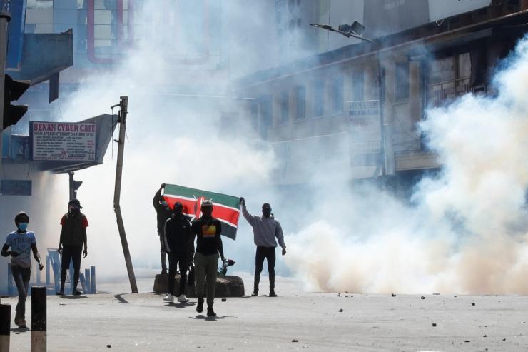 Demonstrators react as police use tear gas to disperse protesters during a demonstration against Kenya’s proposed finance bill 2024/2025 in Nairobi, Kenya, June 25, 2024. REUTERS/Monicah Mwangi
