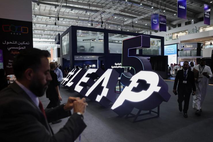Visitors make their way to the main hall during the opening ceremony of the technology event LEAP in Riyadh.
