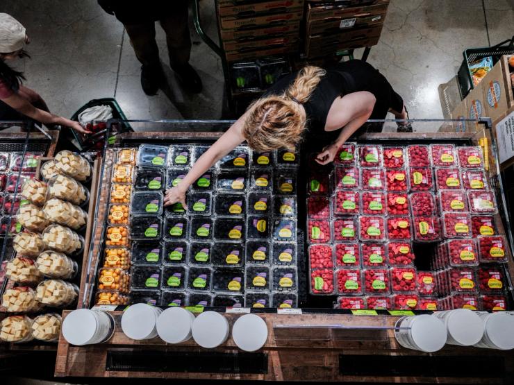 People shop for groceries at a store in New York City, US.
