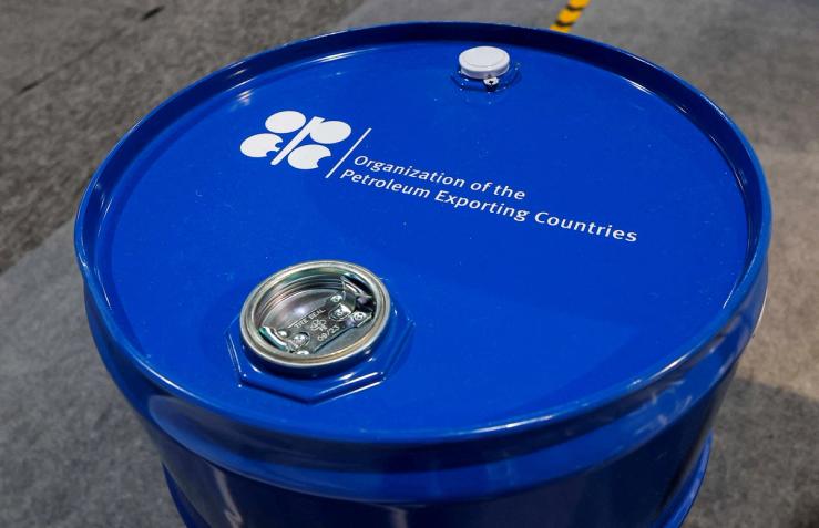 An installation depicting barrel of oil with the logo of Organization of the Petroleum Exporting Countries