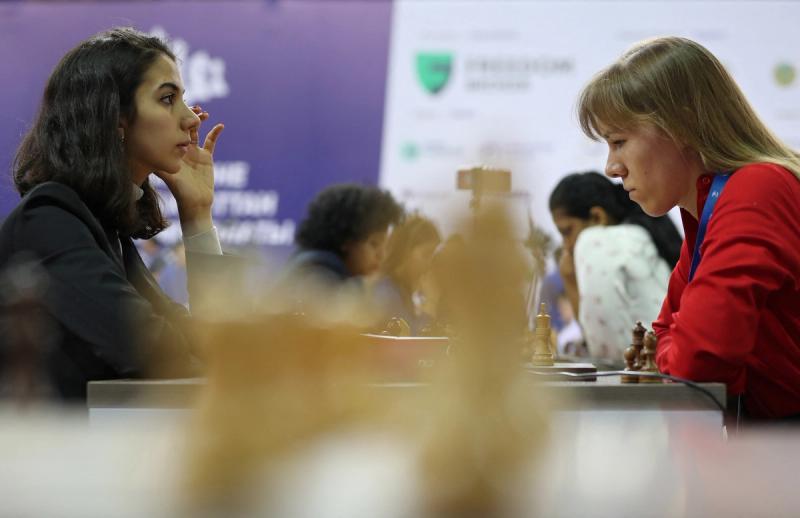 Sara Khadem of Iran (L) competes against Olga Girya of Russia