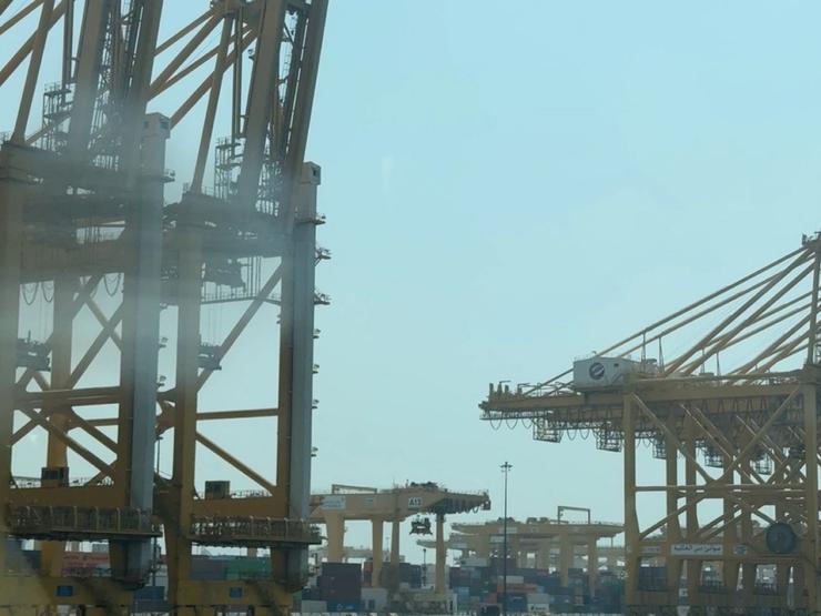 Eaised cranes and stacked containers at Jebel Ali.