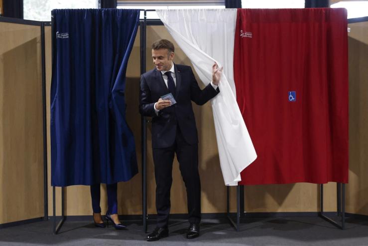 French President Emmanuel Macron votes in the second round of French parliamentary elections.
