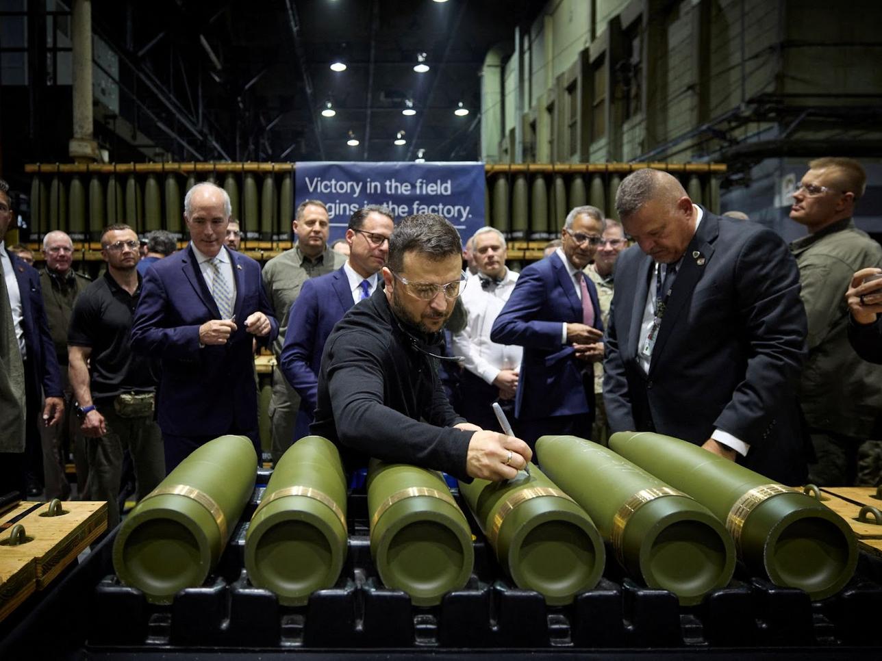 Zelenskyy at an arms manufacturing facility.