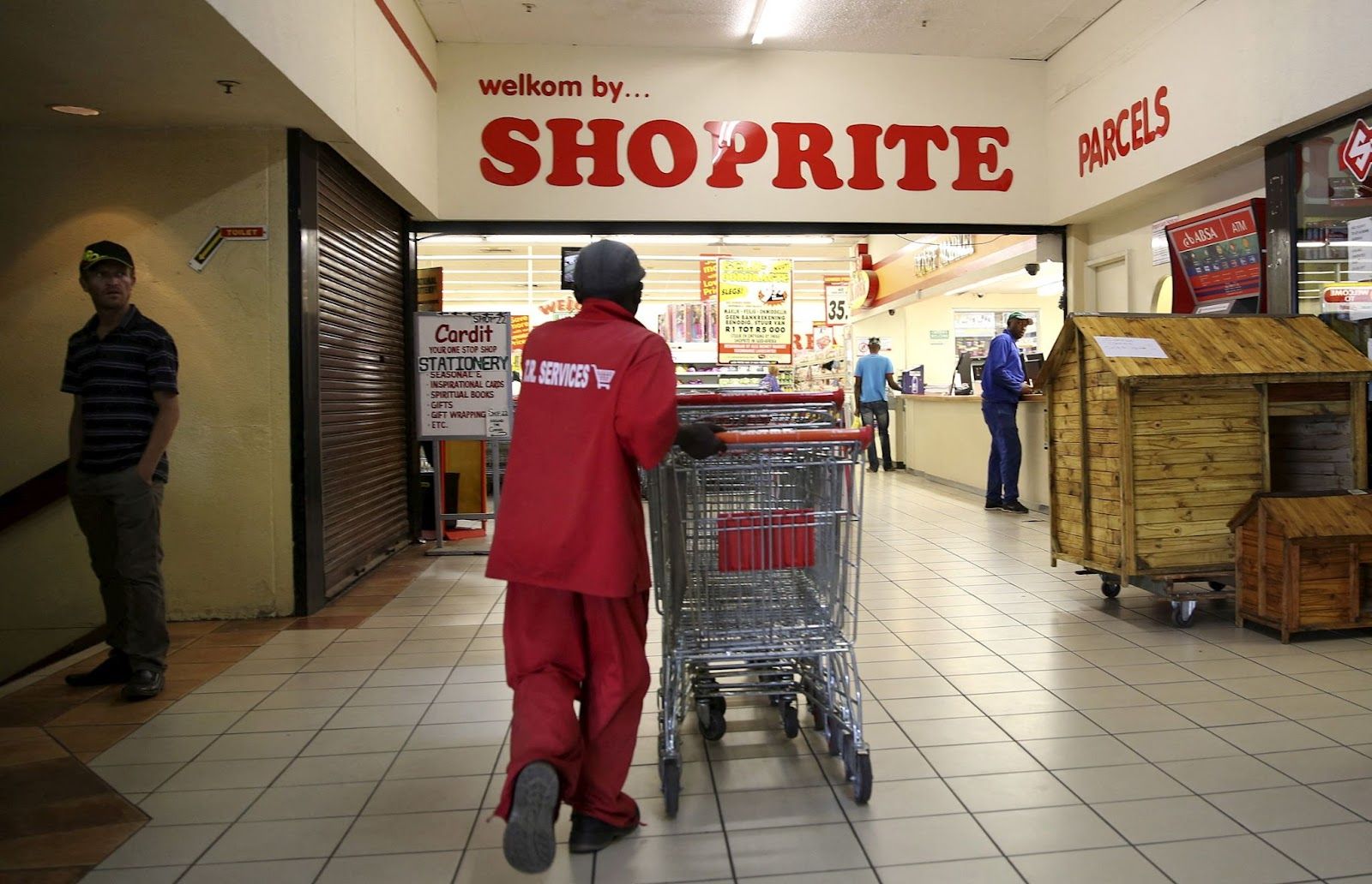 A worker pushes trolleys at the Shoprite store in Johannesburg, South Africa.