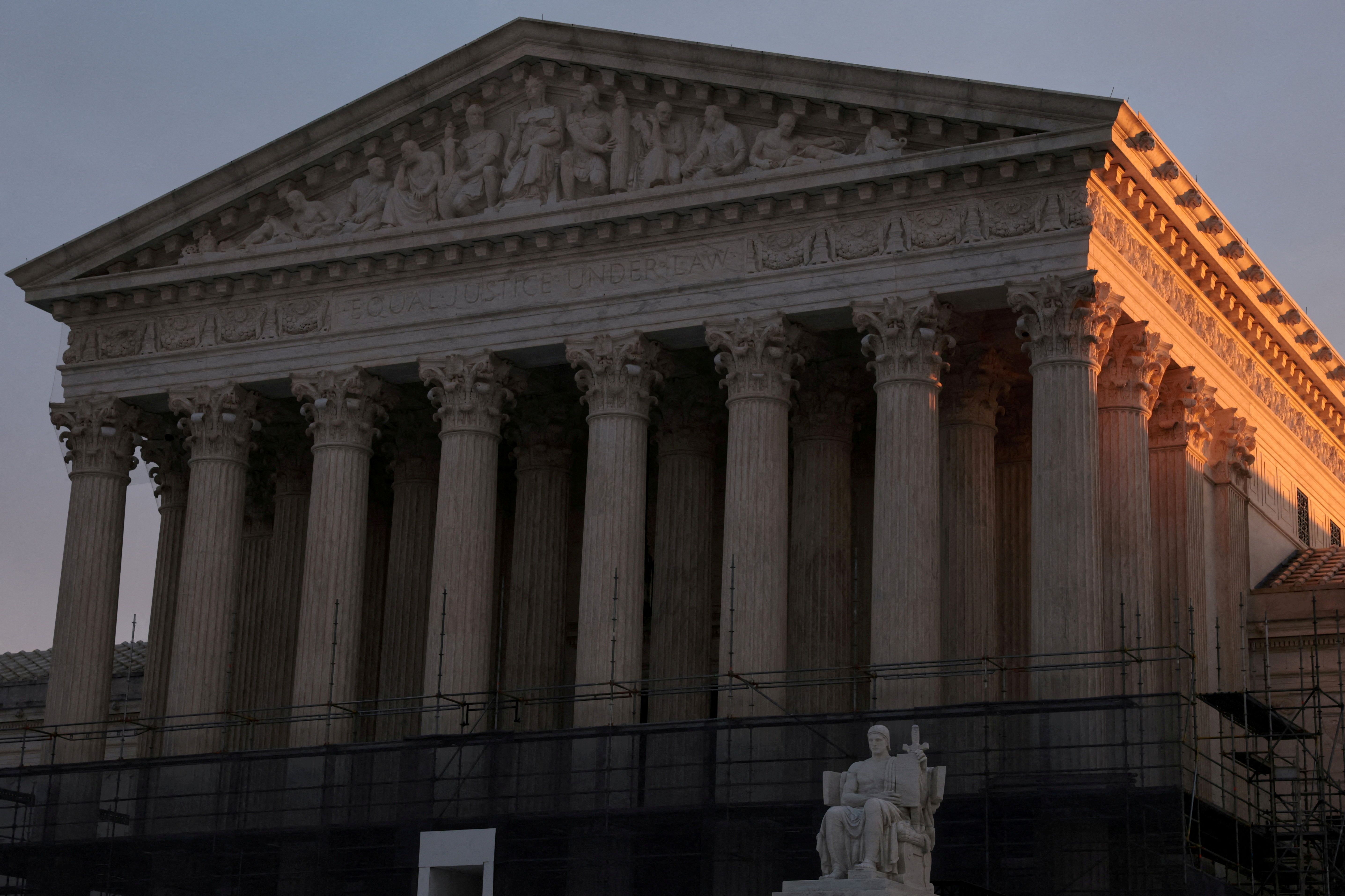 Light from the rising sun hits the US Supreme Court.
