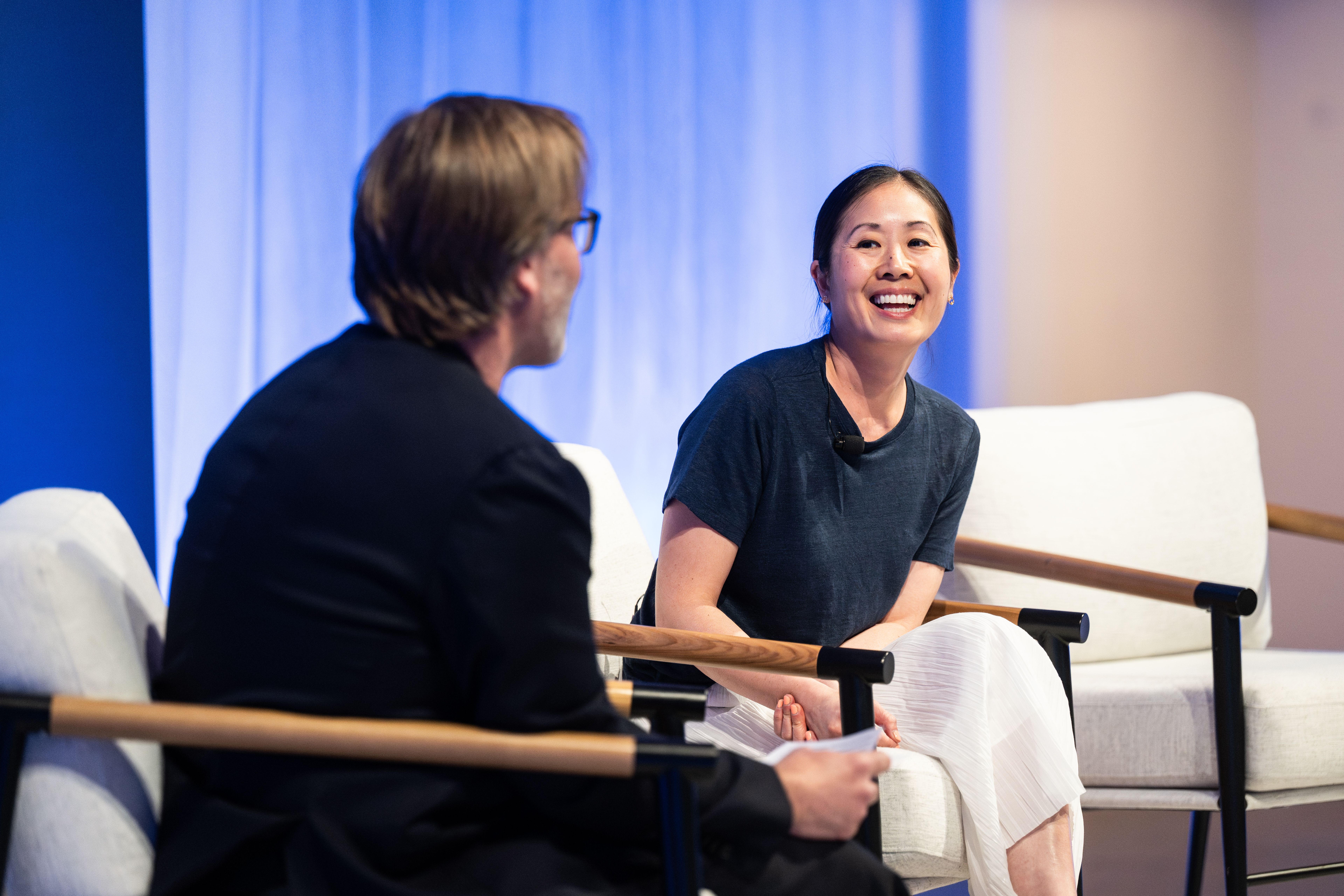Charina Chou on stage with Reed Albergotti.