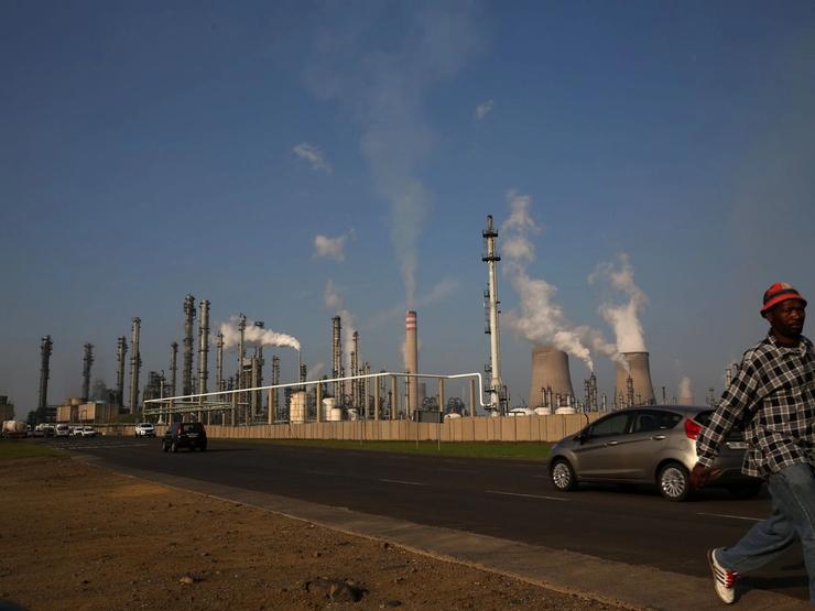 A man walks past Sasol’s synthetic fuel plant in Secunda.