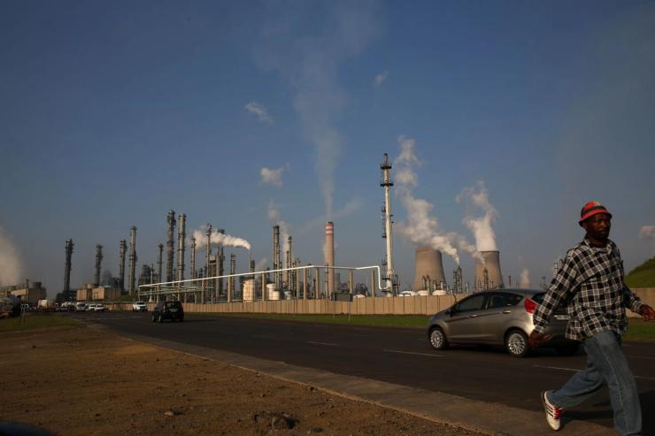 A man walks past Sasol’s synthetic fuel plant in Secunda.