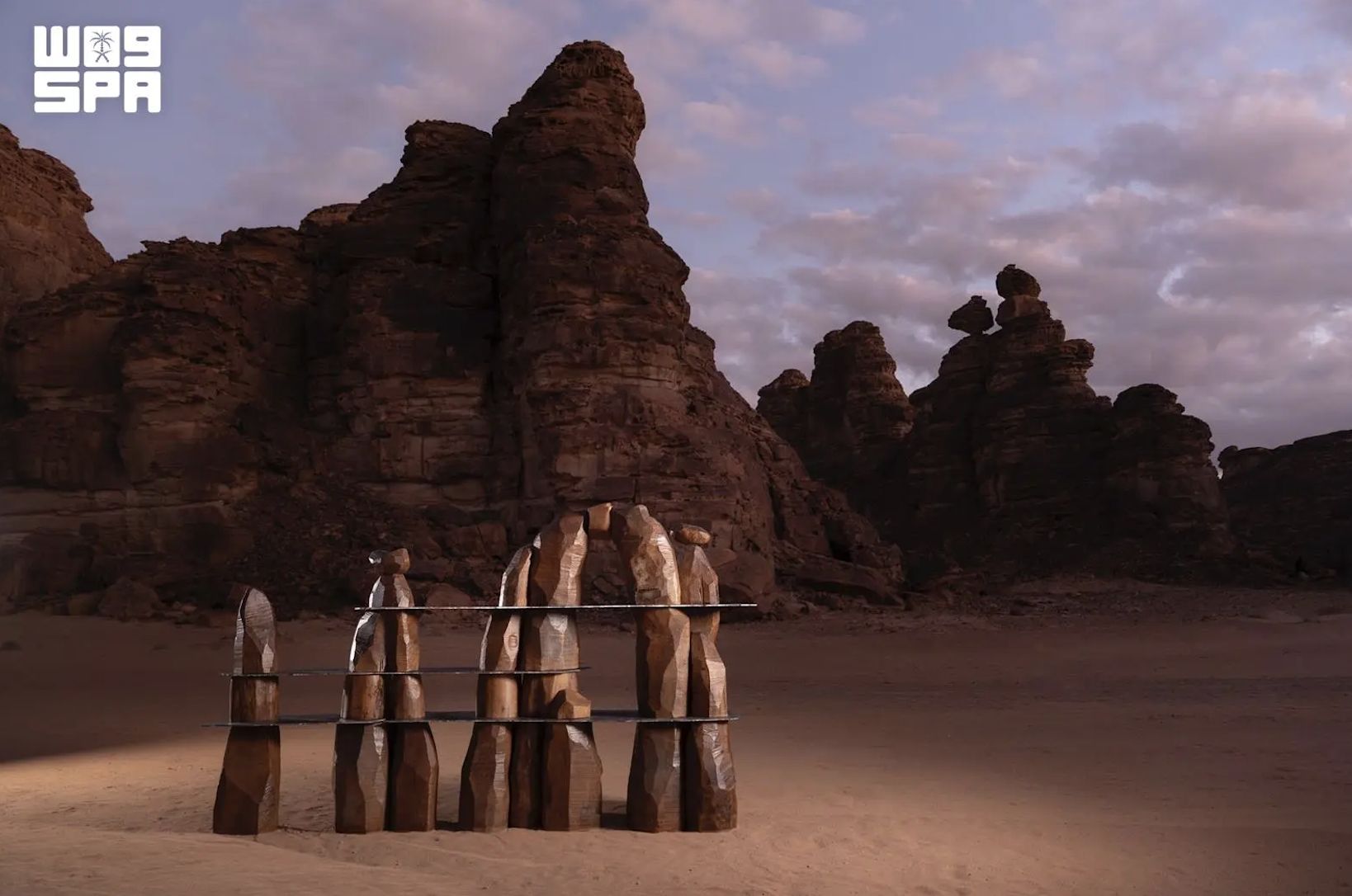 Photo of the “Our Alula Trilogy” sculpture made by Studio ALTIN on display in the desert of AlUla