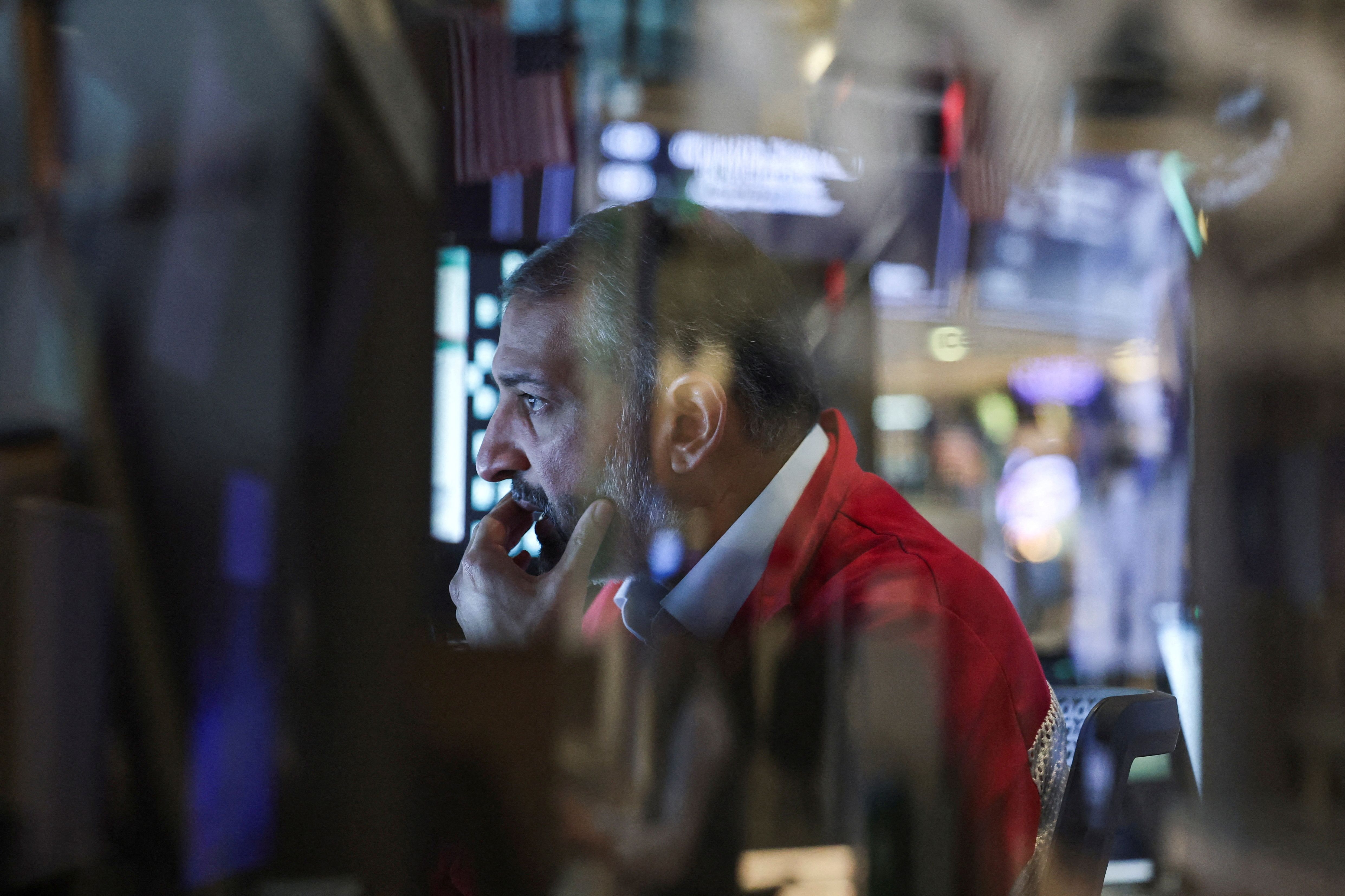 A trader works on the floor at the New York Stock Exchange