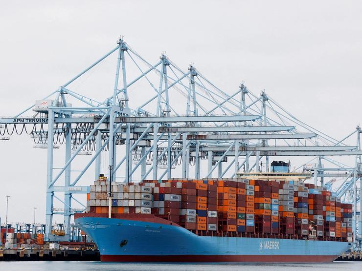 Shipping containers sit on a Maersk vessel docked at the port of Los Angeles.