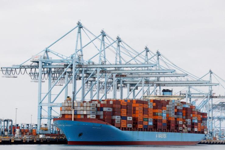 Shipping containers sit on a Maersk vessel docked at the port of Los Angeles.