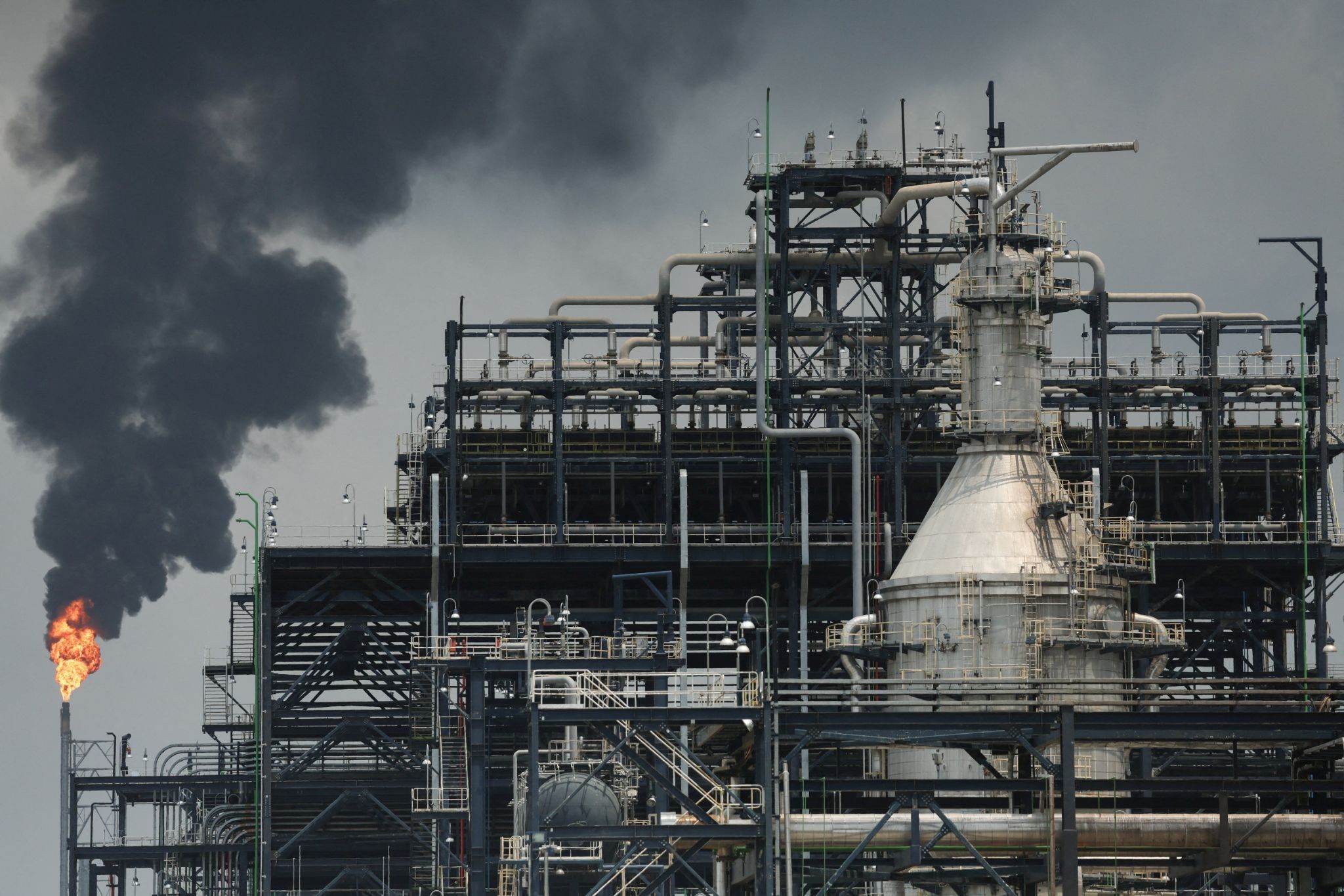 A flame rises from a gas flare at the Dangote Industries oil refinery and fertilizer plant site in the Ibeju Lekki district of Lagos, Nigeria.