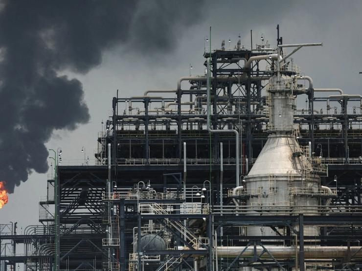 A flame rises from a gas flare at the Dangote Industries oil refinery and fertilizer plant site in the Ibeju Lekki district of Lagos, Nigeria.