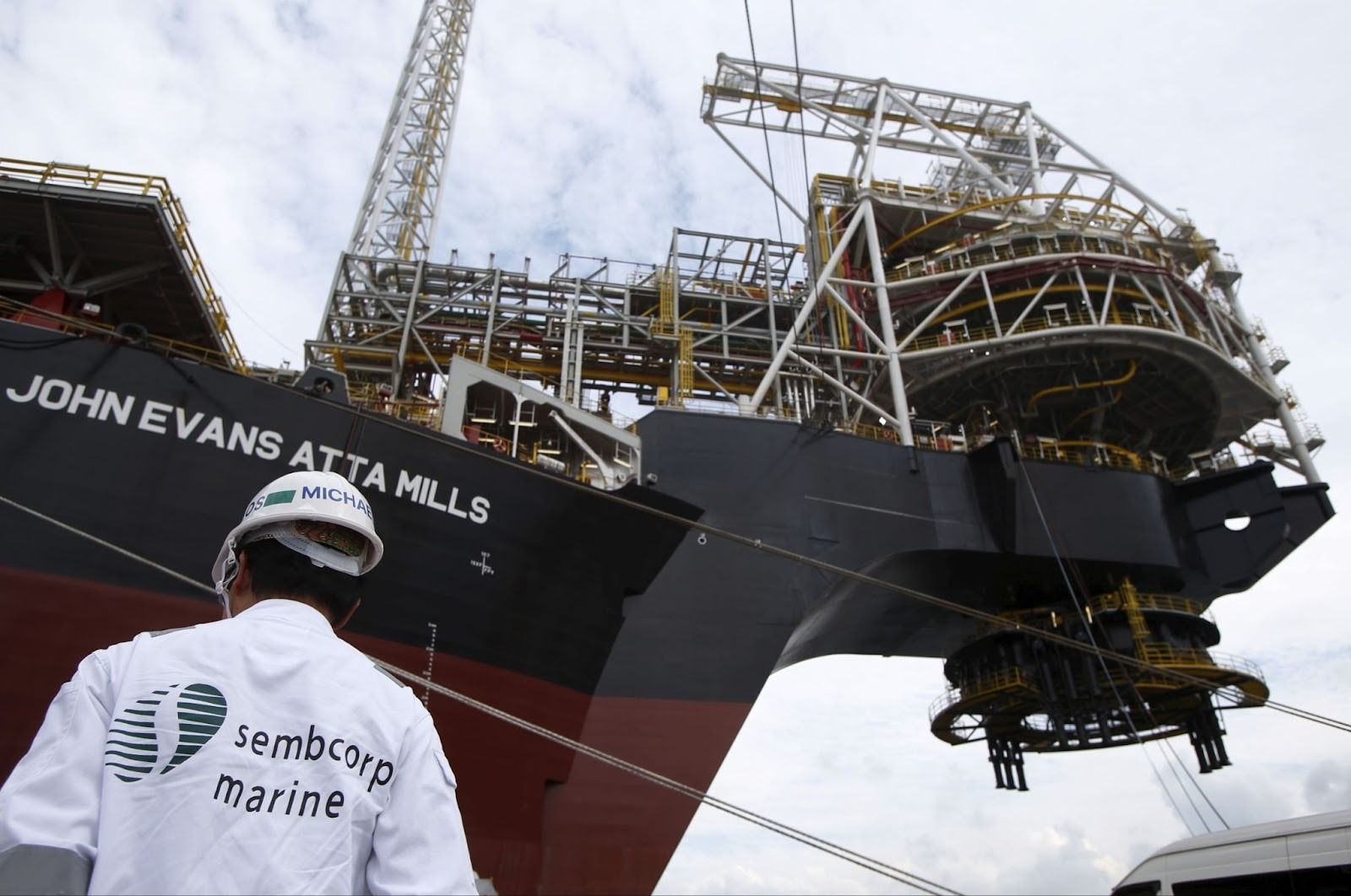 A Sembcorp employee stands near the turret of Tullow Oil’s newly completed Floating Production, Storage and Offloading vessel.