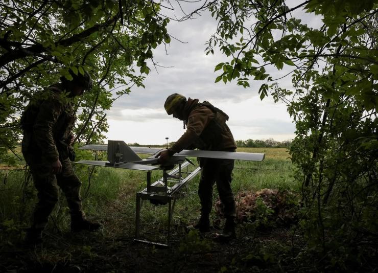 An servicemen of the 15th Operative Purpose Brigade Kara-Dag, of the National Guard of Ukraine, prepare a Darts strike drone for flight over positions of Russian troops, amid Russia’s attack on Ukraine, near Kupiansk, Kharkiv region, Ukraine May 11, 2025