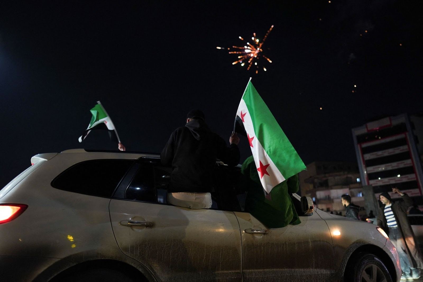 Civilians celebrating the entrance of Syrian forces to Raqqa. 