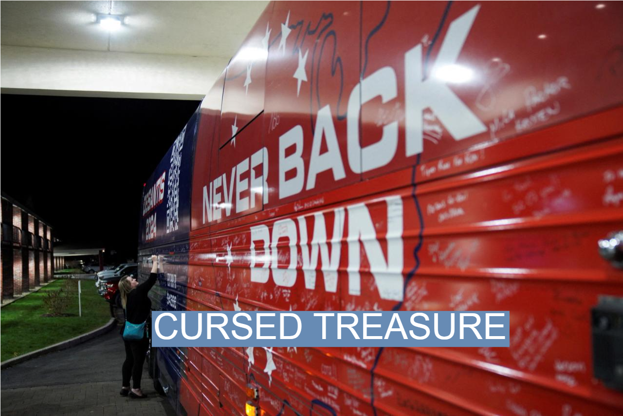 A New Hampshire resident signs Ron Desantis’ campaign bus.