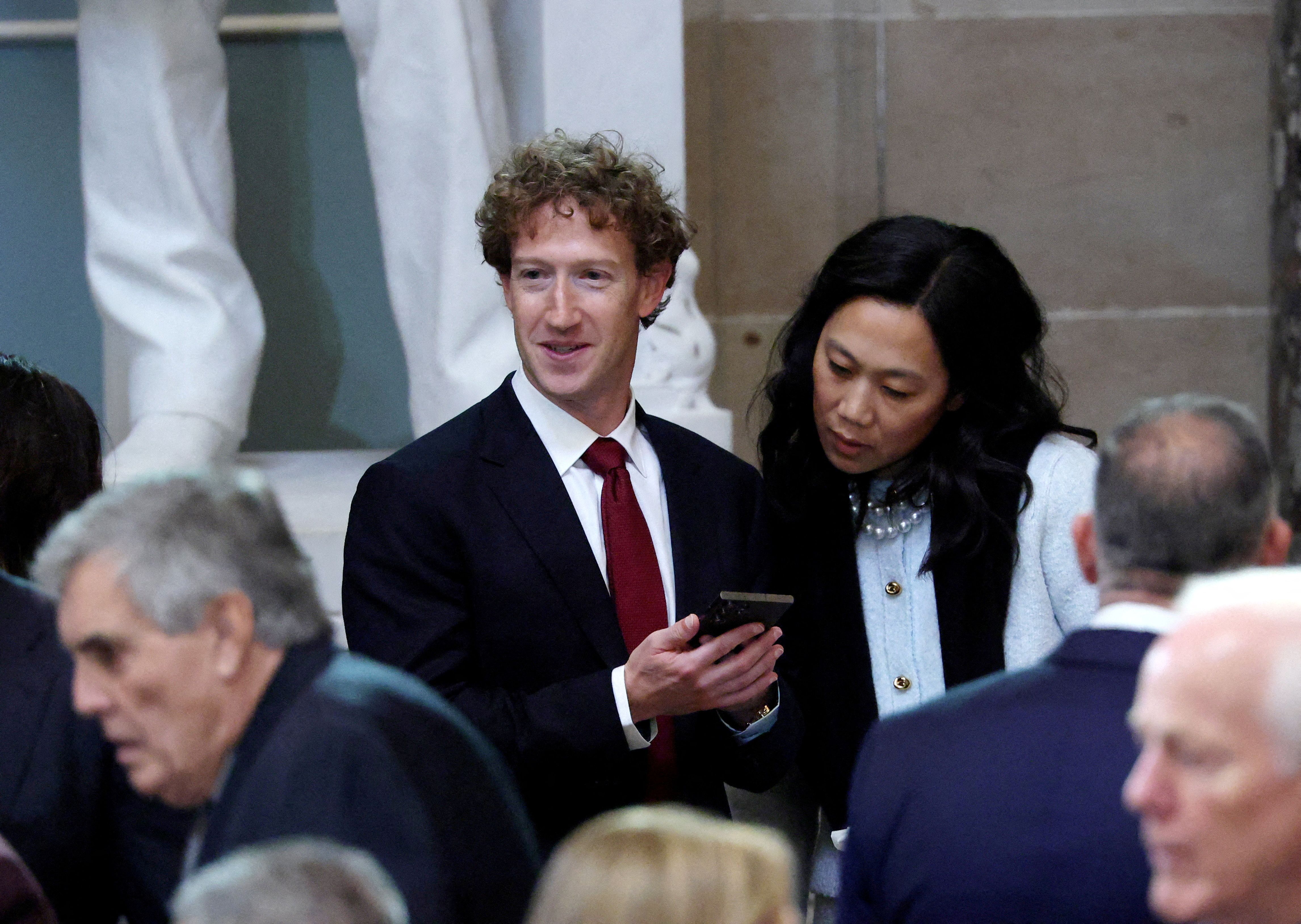 Meta CEO Mark Zuckerberg and Priscilla Chan in the Statuary Hall of the U.S. Capitol.