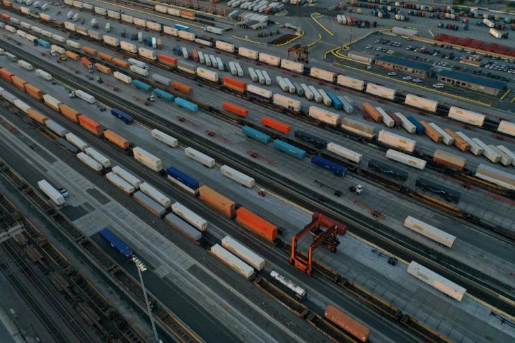 An aerial view of shipping containers and freight railway trains at the Union Pacific Los Angeles (UPLA) Intermodal Facility rail yard in Commerce, California.