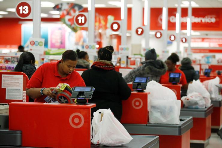 Cashiers check out for Thanksgiving Day shoppers at a Target store in Chicago.