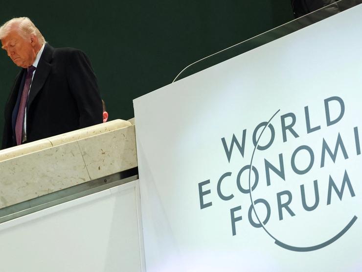 U.S. President Donald Trump walks during the 56th annual World Economic Forum (WEF) meeting in Davos