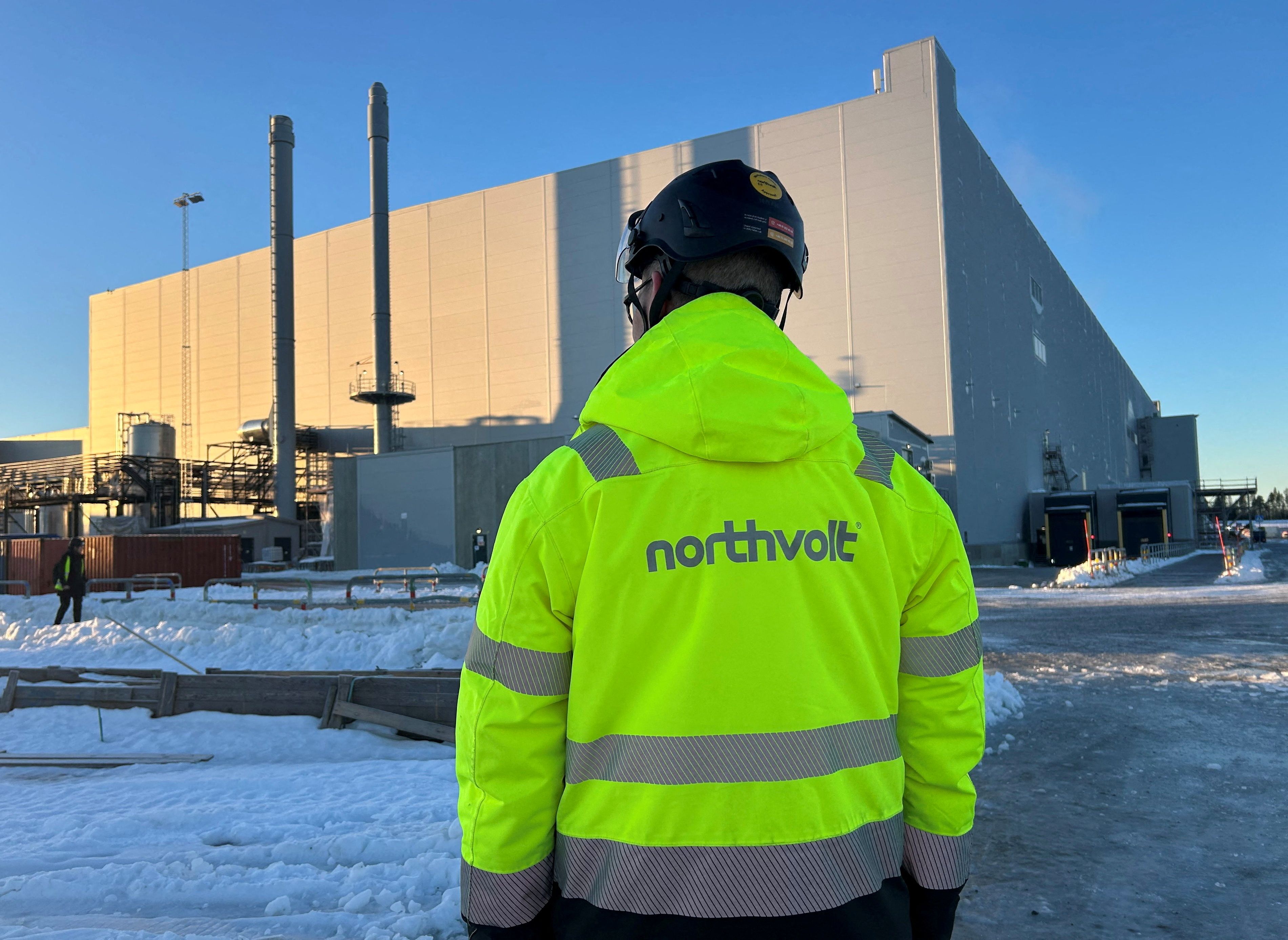 A man stands in front of the Northvolt Ett factory in Skelleftea, Sweden, November 27, 2024