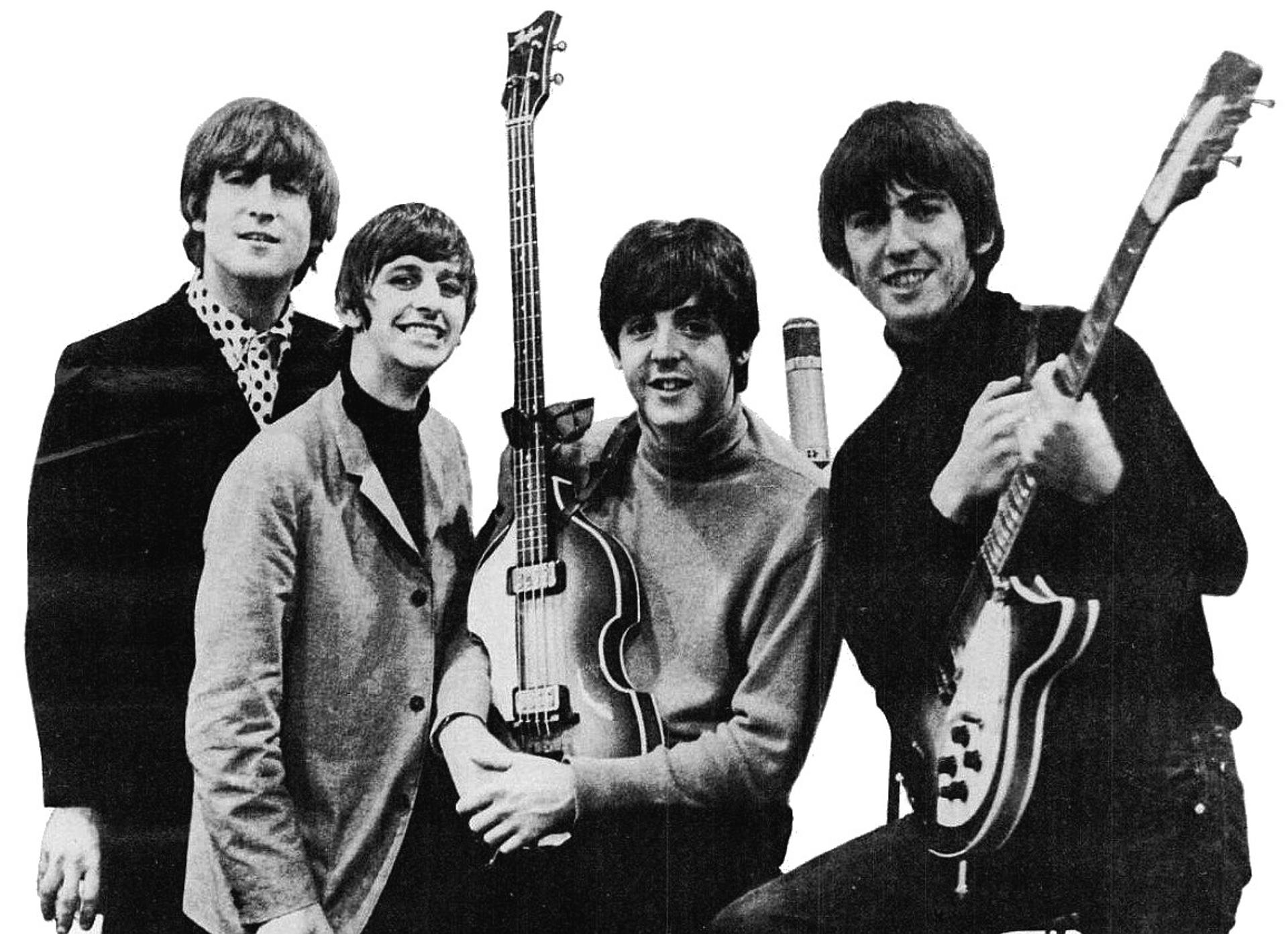 A black and white photo of the Beatles.