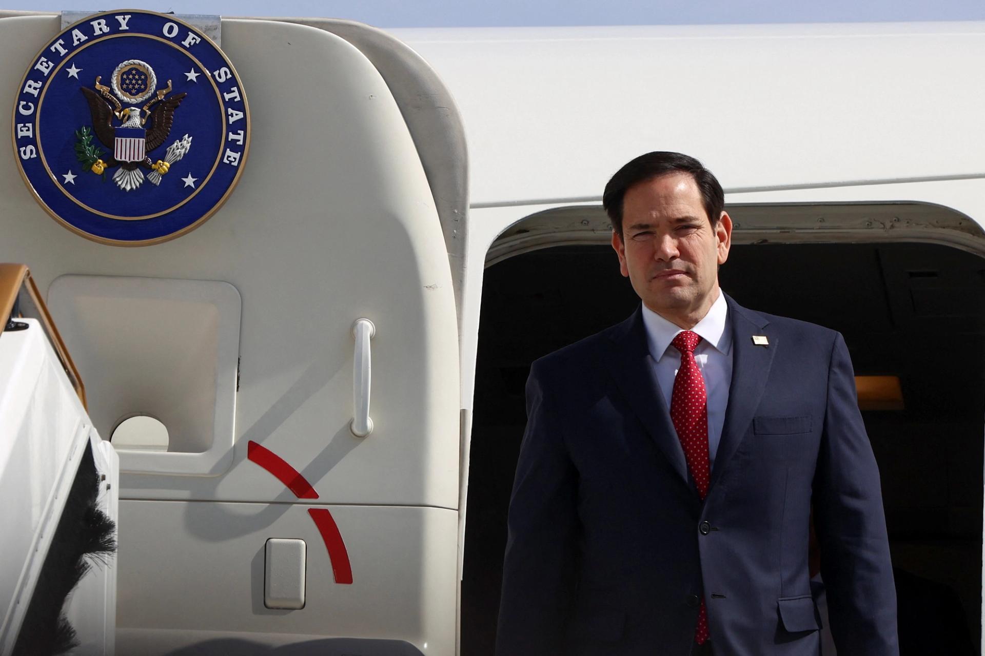 US Secretary of State Marco Rubio disembarks from a plane.