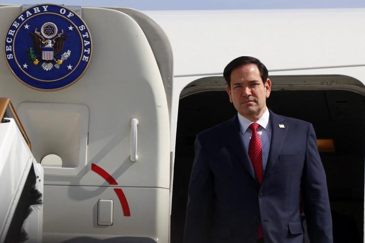 US Secretary of State Marco Rubio disembarks from a plane.