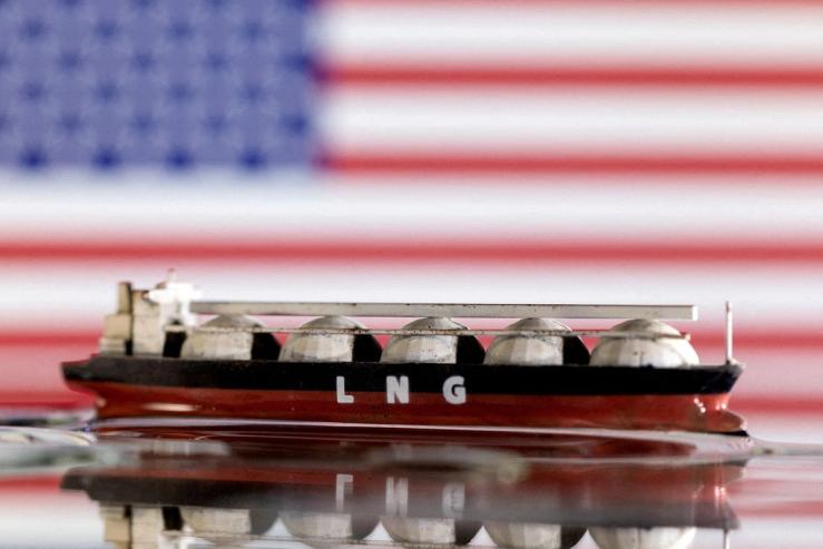 Model of LNG tanker is seen in front of the US flag in this illustration taken May 19, 2022/