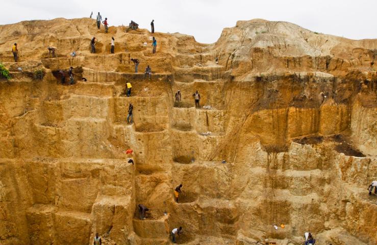 Laborers work at a mine in Minna