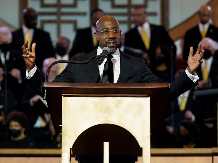US Senator Raphael Warnock (D-GA), a senior pastor at Ebenezer Baptist Church, speaks ahead of the holiday honoring Martin Luther King Jr., in Atlanta, Georgia, U.S.,
