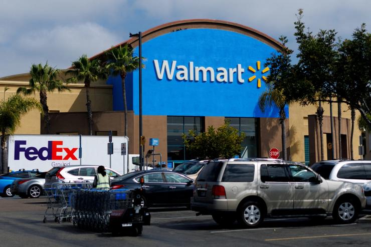Cars are parked outside a Walmart store in Oceanside, California.