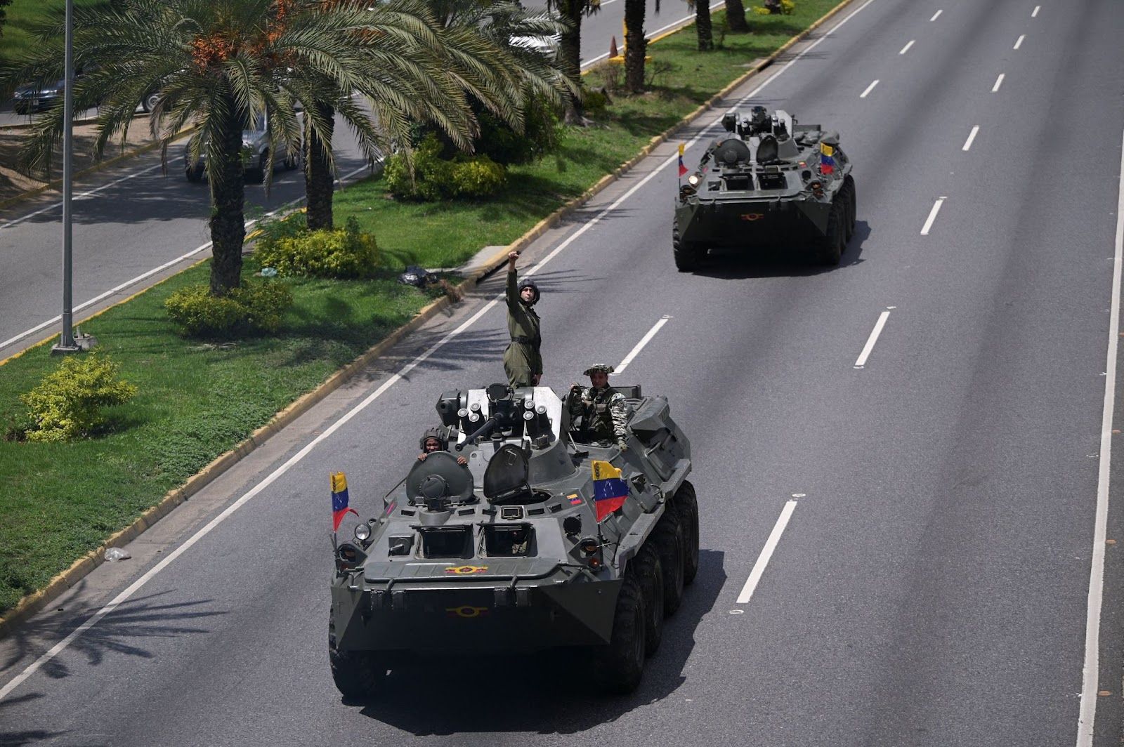 A tank rolling down a street in Venezuela