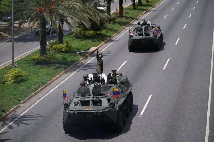 A tank rolling down a street in Venezuela