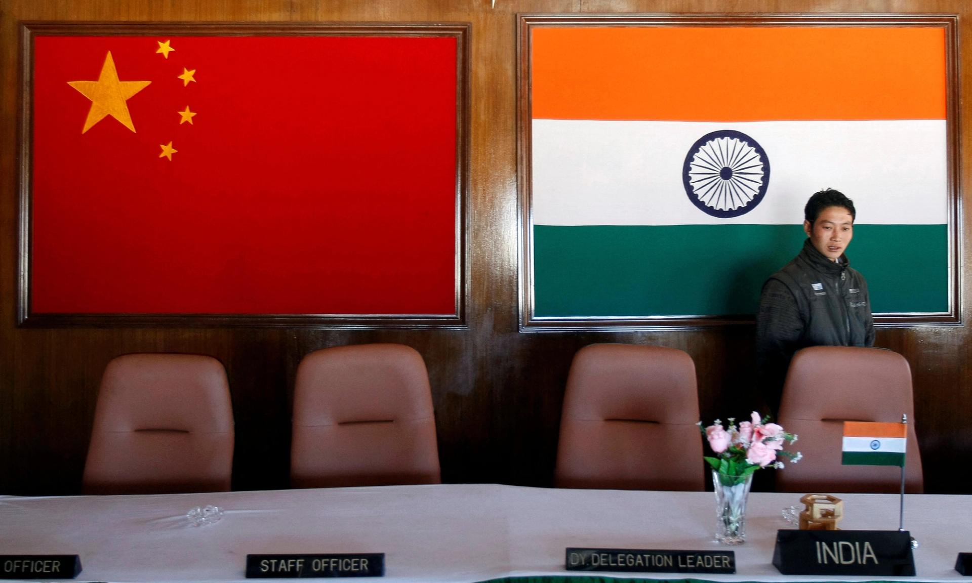  A man walks inside a conference room used for meetings between military commanders of China and India.