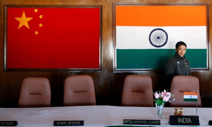 A man walks inside a conference room used for meetings between military commanders of China and India.