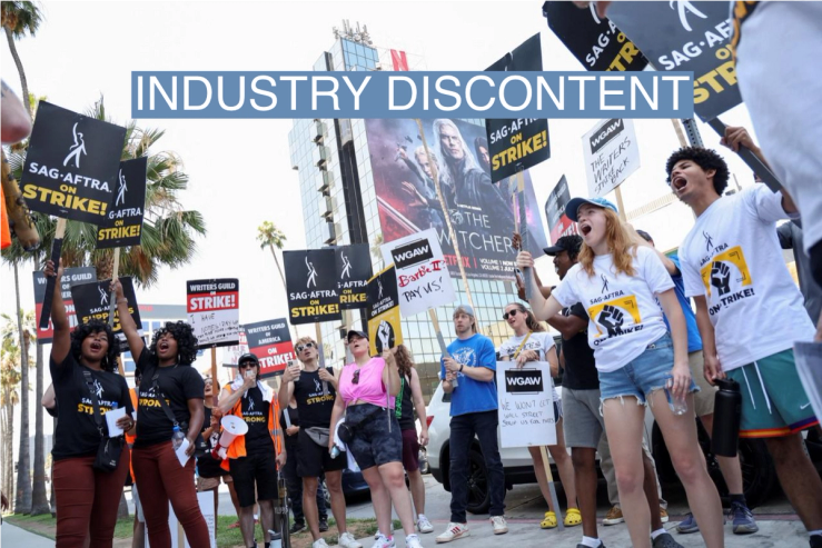 Gabrielle and Rachel Newman, also known as the Newman twins, and other demonstrators attend SAG-AFTRA actors’ and Writers Guild of America (WGA) writers’ ongoing strike, outside Netflix offices in Los Angeles, California, U.S., August 4, 2023. REUTERS/Mario Anzuoni