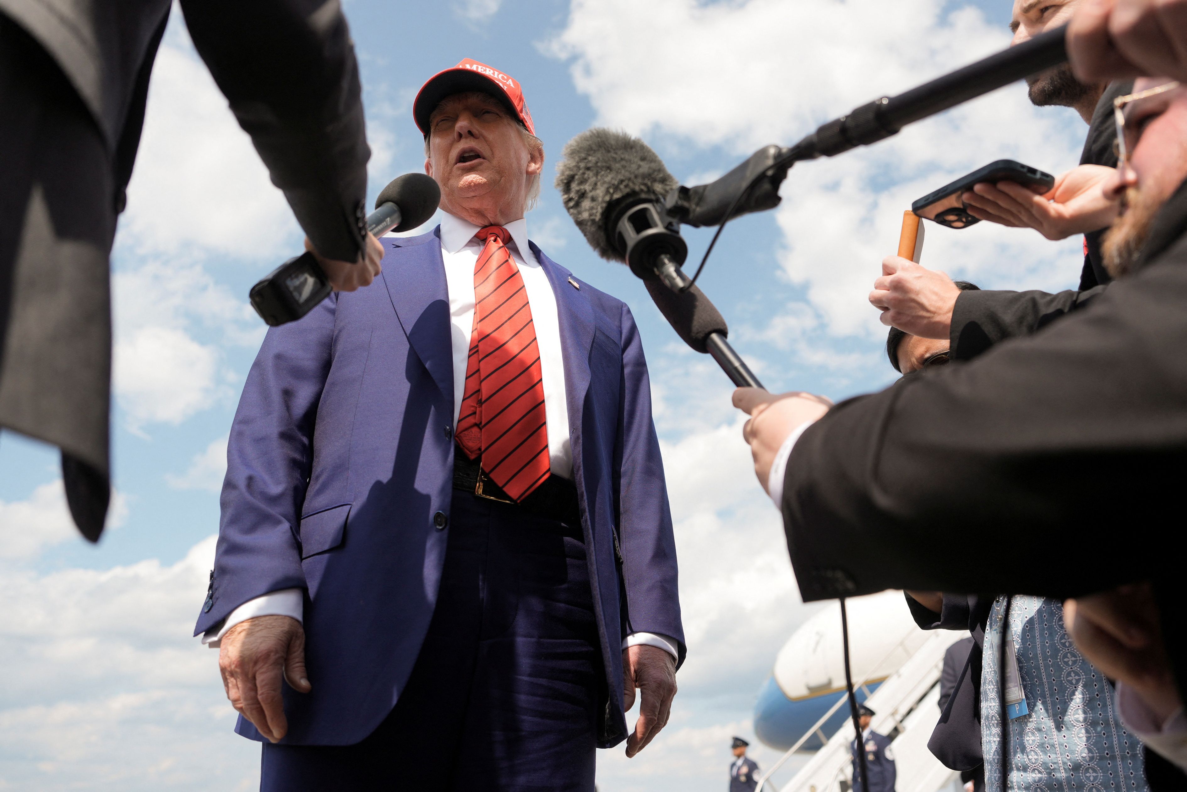 US President Donald Trump talks to reporters upon his arrival at Morristown Municipal Airport in Morristown, New Jersey, on June 20.