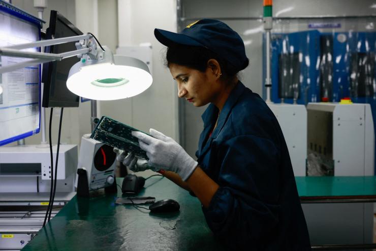 A worker in a factory in Noida, India.